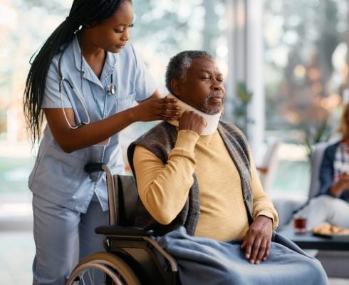 young-black-nurse-adjusting-neck-collar-to-elderly-2022-12-06-01-11-50-utc-scaled-500x500